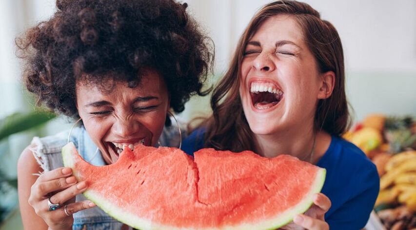 The girls eat watermelon